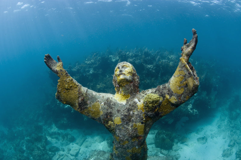 The open arms of Christ of the Abyss statue, located underwater at Key Largo Dry Rocks, Key Largo, Florida, September 9, 2007 offer peace to those who see the statue. The bronze statue was placed near the coral reef in August of 1965 after being donated to the Underwater Society of America.