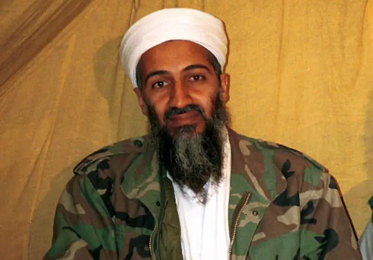 FILE - This undated file photo shows al Qaida leader Osama bin Laden in Afghanistan. A new book due out Tuesday, Oct. 16, 2012 says President Barack Obama hoped to put Bin Laden on trial if he had surrendered during a U.S. raid. Author Mark Bowden quotes the president as saying he thought he could make a strong political argument for giving bin Laden the full rights of a criminal defendant, to show U.S. justice applies even to him. In "The Finish," Bowden writes, however, that Obama said he expected the terror leader to go down fighting. (AP Photo)